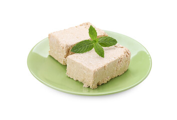 Plate with pieces of tasty halva and mint isolated on white