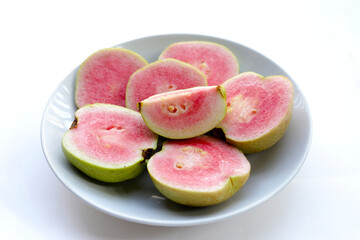 Fresh pink guava on white background.