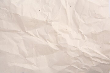 Texture of crumpled parchment paper as background, top view