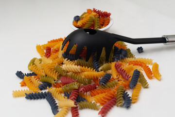 multicolor spiral pasta in bowl ,top view