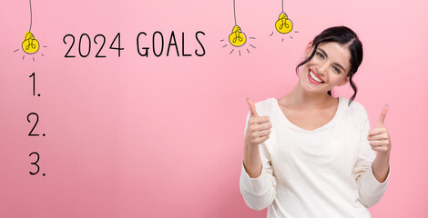 2024 goals with happy young woman giving thumbs up