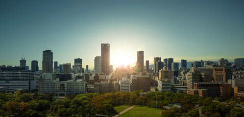 Naklejka premium Panorama skyline of Osaka City View From Osaka Castle Tenshukaku during sunset.