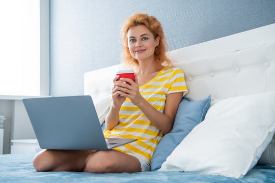 communication of cheerful woman with coffee and laptop. online communication of woman