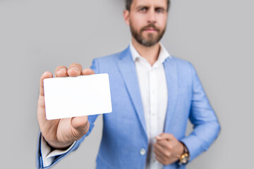 Business deal with emoney. Success of business. businessman in suit hold credit card isolated on grey. Business branding. Pay the bill. businessman with credit card in studio. emoney payment
