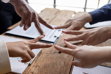 Business team standing hands together, Volunteer charity work. People join for cooperation success...