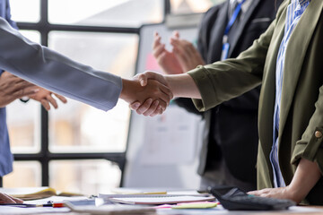 Business Team offer and give hand for handshake in office. Successful job interview. Apply for loan...