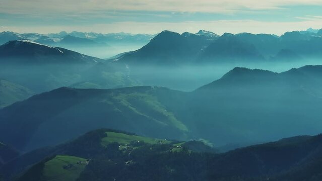 Aerial view of smoky mountains under mist in morning. Amazing nature scenery in Dolomites, Italy. Tourism and travel concept, panorama 4k