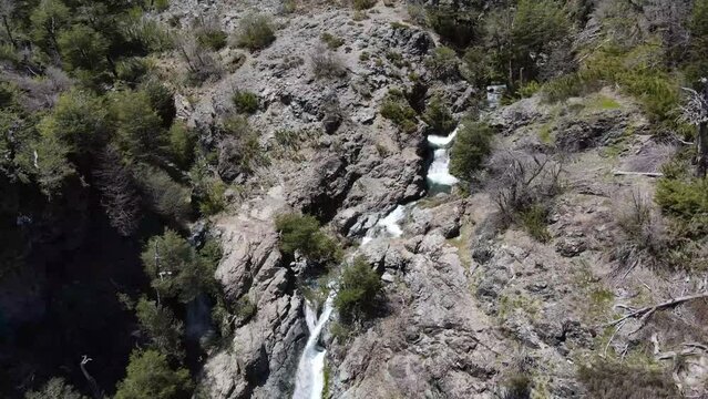 Drone footage of waterfall and river in the Andes Mountains in Chile