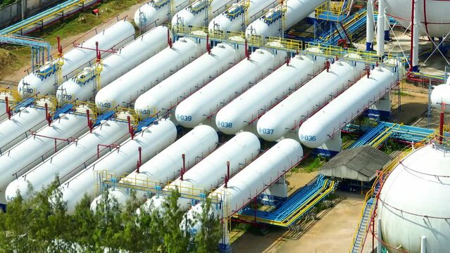 Natural gas storage is an integral part of the energy sector, involving the use of salt caverns, aquifers, or depleted reservoirs to maintain a steady gas supply for industries. Aerial view drone.
