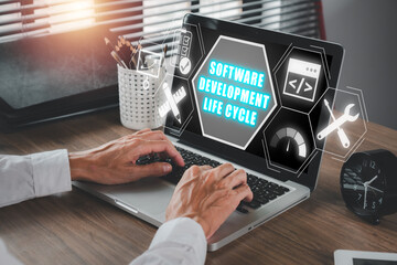 Software development life cycle concept, Businessman using laptop computer on desk with software development life cycle icon on virtual screen. - obrazy, fototapety, plakaty