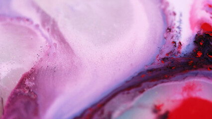 Ink fluid mix. Paint water flow. Defocused purple red white color glitter marble texture wet dye...