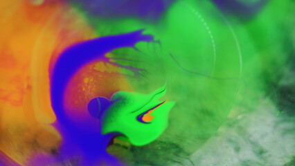 Obraz na płótnie Canvas Abstract background. Paint mix bubbles. Colorful fluid art. Bright purple blue green orange blot spreading motion in hypnotic creative liquid oil design.