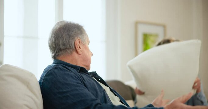Senior couple, angry and arguing on divorce, stress and conflict on couch in living room. Elderly people, fighting and sad for cheating, affair and mistake or frustrated, mad and whatever on problems