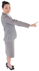Papier Peint photo Lieux asiatiques Digital png photo of smiling asian businesswoman pointing with finger on transparent background