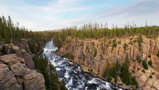 South Yellowstone Teton Grand National Park Lewis Fall waterfall entrance late afternoon sunset stunning Yellowstone river lookout point beautiful fall autumn October pan left slowly movement
