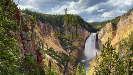 Grand Canyon of the Yellowstone National Park river Upper lower Falls waterfall HDR lookout artist point autumn Canyon Village lodge roadway stunning daytime landscape view cinematic pan right slowly