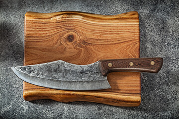 Meat Knife Damascus Steel On Vintage Wooden Board.