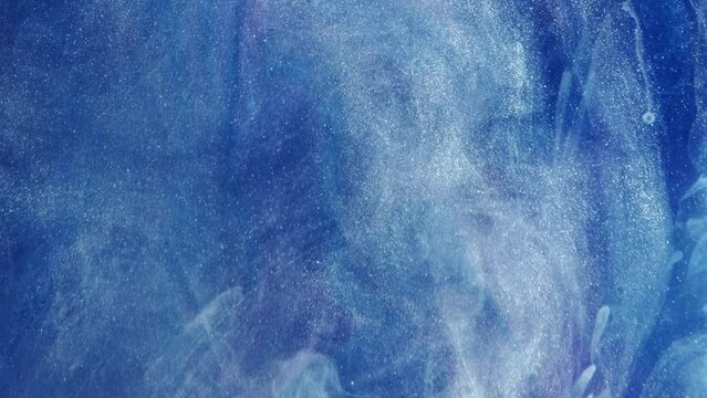 Vertical video. Smoke cloud background. Mysterious sky. Blue glitter ink abstract magic heaven air flow spreading in shimmering water hypnotic creativity art.