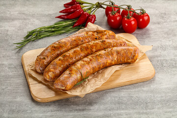 Raw sausages with spices and herbs