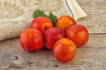 Red juicy raw plum heap