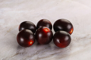 Raw ripe black kumato tomato