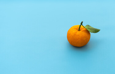 Orange fruit isolated on blue background. After some edits.