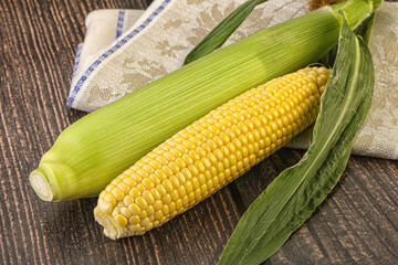 Yellow sweet raw cob corn