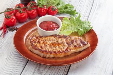 Grilled pork steak with ketchup