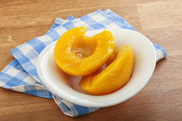 Sweet canned peaches with syrope