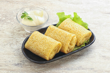 Stuffed pancakes with meat and cream