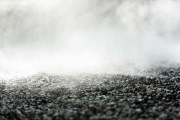 gravel texture floor with mist or fog. Light, dark and gray abstract gravel texture for display...