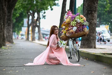 Kissenbezug A young girl wearing a lotus pink color ao dai the traditional costume of Vietnam. Photo for tourism, culture, tradition, and the beauty of Asian people. Idea for train model in computer vision system © Dung