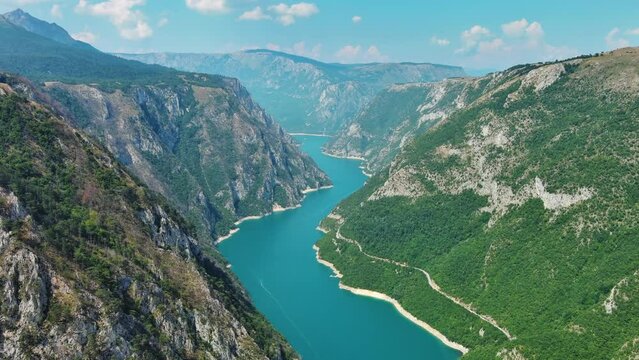 Aerial view of Beautiful Piva river canyon with reservoir Piva Lake (Pivsko Jezero) summer view in Montenegro. Nature travel background, 4k 