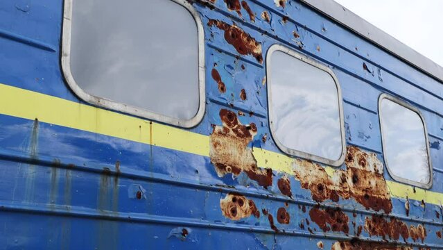 Ukrainian Civil Train Covered in Shrapnel and Bullets From Russian Attack on Display in Kyiv War Exhibition at Sophia Square
