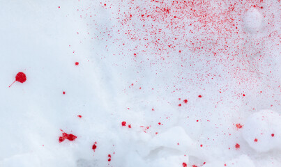 Blood on white snow as a background