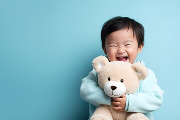 Adorable Fictional Little Boy in Plain Casual Shirt Holding a Teddy Bear and Smiling. Isolated on a plain blue background. Generative AI.
