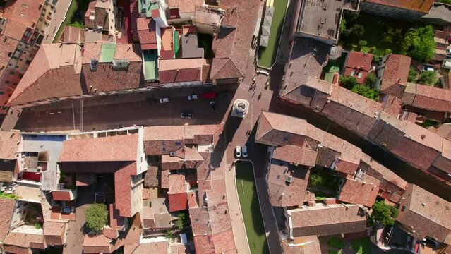 Comacchio, Italy, drone top down view of urban infrastructure, city's canal, little Italian city, sunny weather