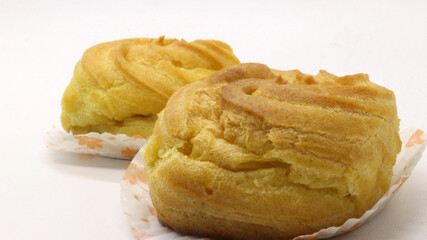 Two traditional cake Cream puffs