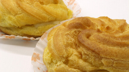 Two traditional cake Cream puffs