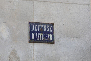 Prohibition to display text board sign on facade wall called defense d'afficher in French language