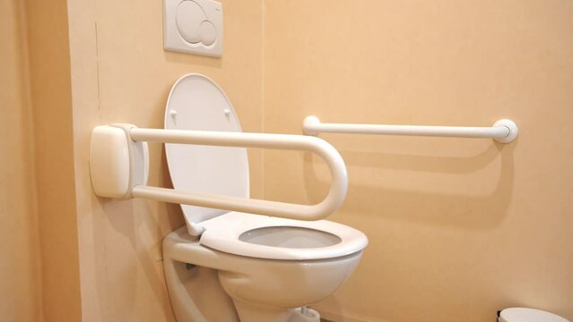 Modern handicapped bathroom for the elderly and disabled, with grab bars and wheelchair access