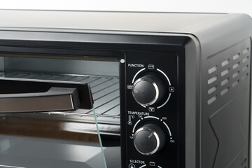 Close up of black mini electric oven home appliance