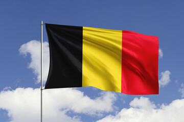 Belgium flag fluttering in the wind on sky.