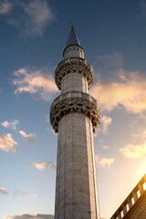 Minaret against the background of the sunset sky.