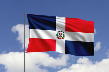 Dominican Republic flag fluttering in the wind on sky.