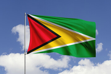 Guyana flag fluttering in the wind on sky.