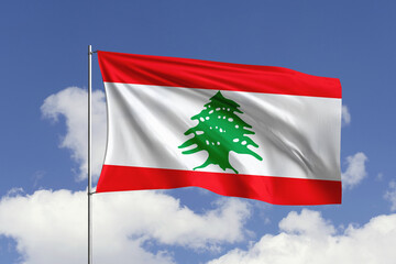 Naklejka premium Lebanon flag fluttering in the wind on sky.
