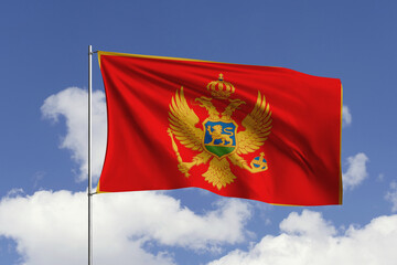 Montenegro flag fluttering in the wind on sky.