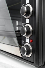 Close up of black mini electric oven home appliance