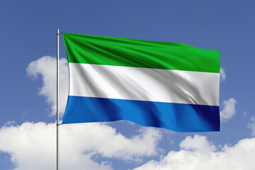 Sierra Leone flag fluttering in the wind on sky.